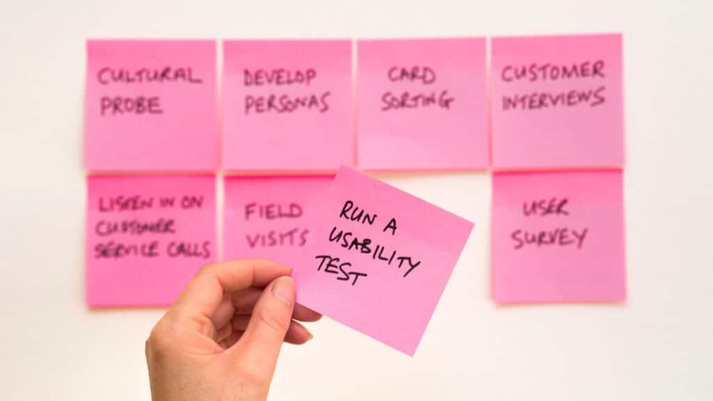 Wall of pink post it notes