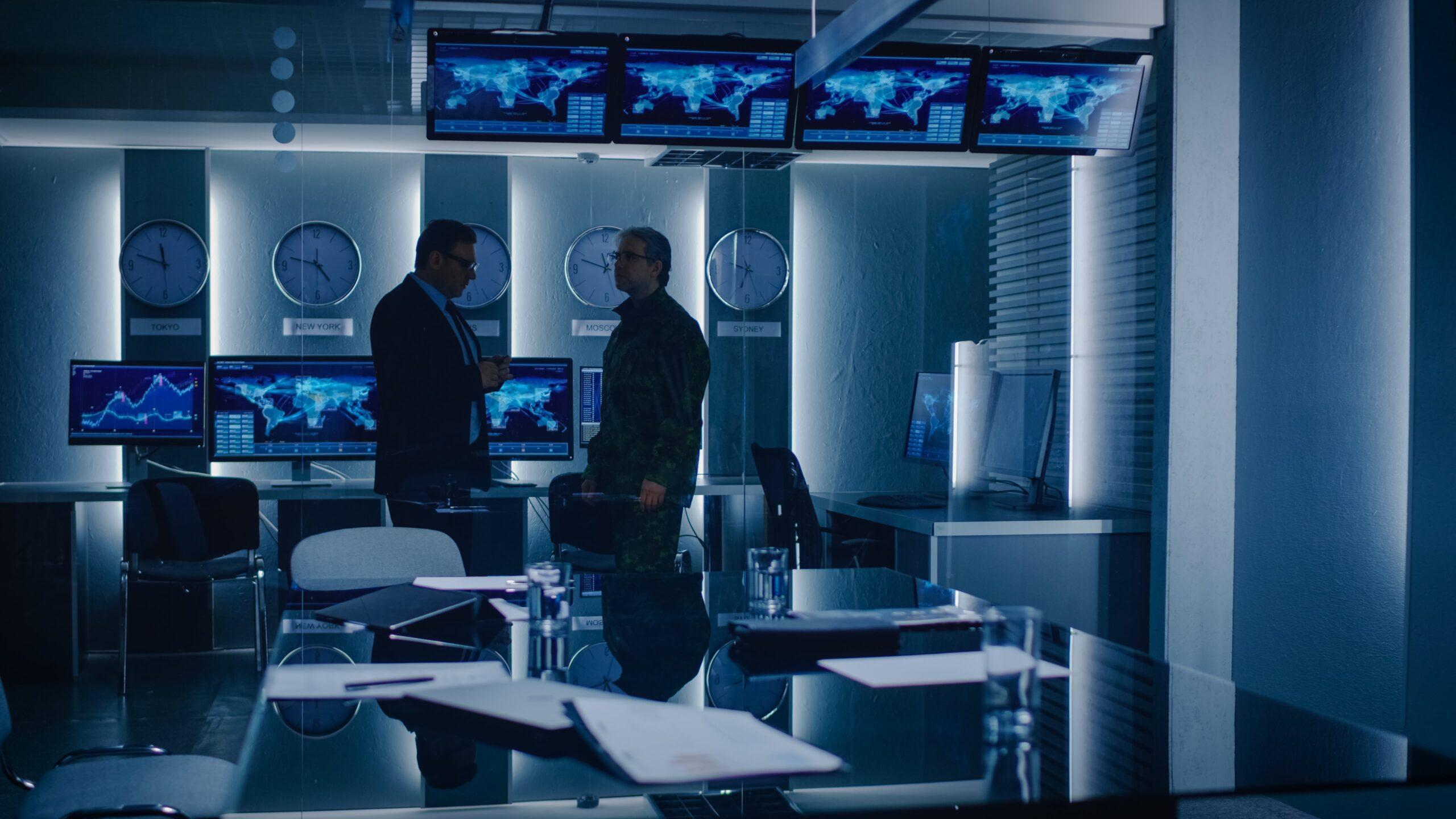 Two men in conversation in office setting