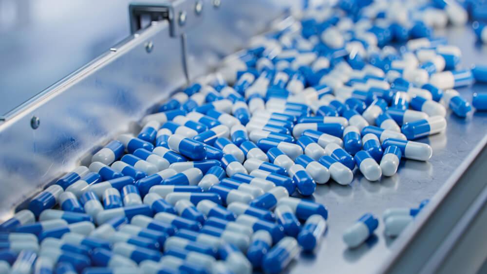 Medicinal pills on steel table top